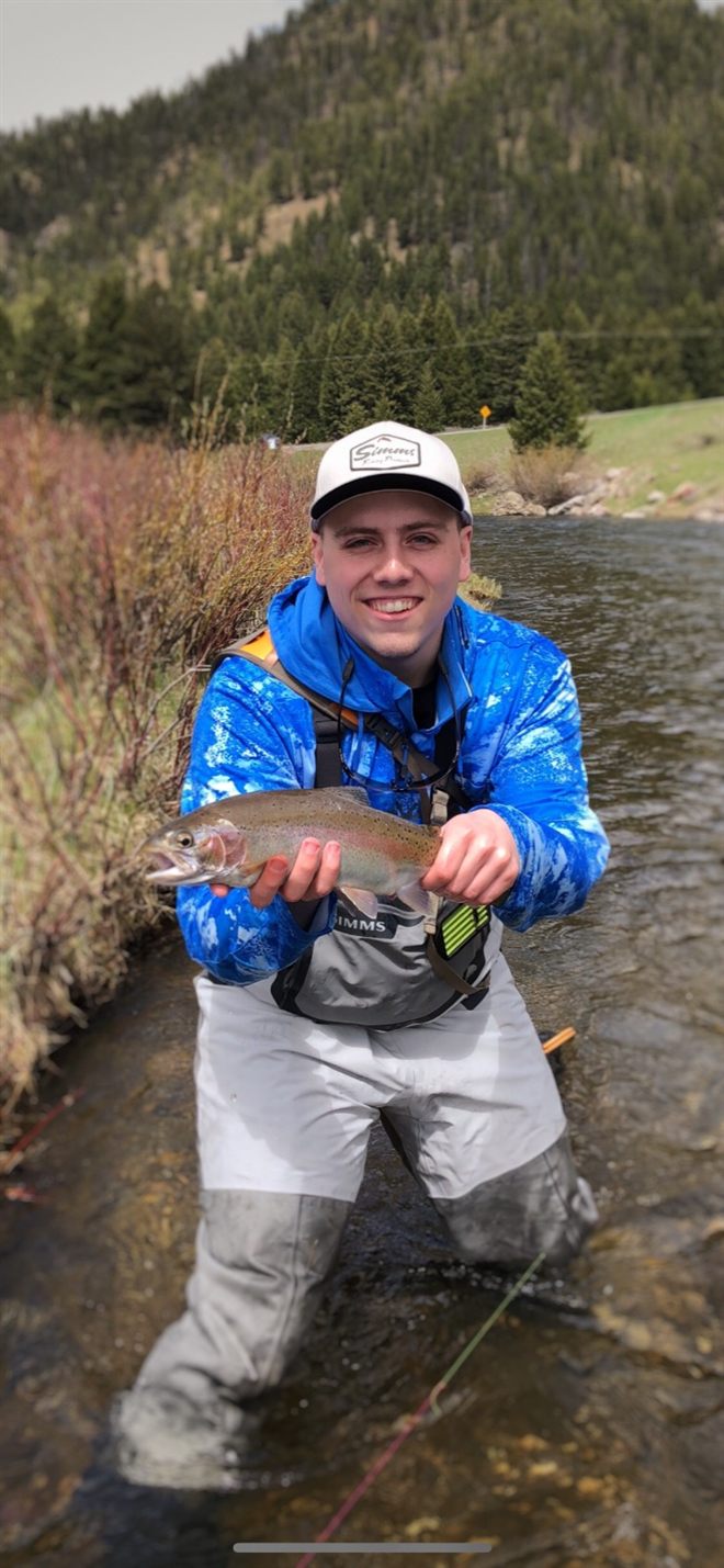 @pike holding a rainbow trout in the Madison River